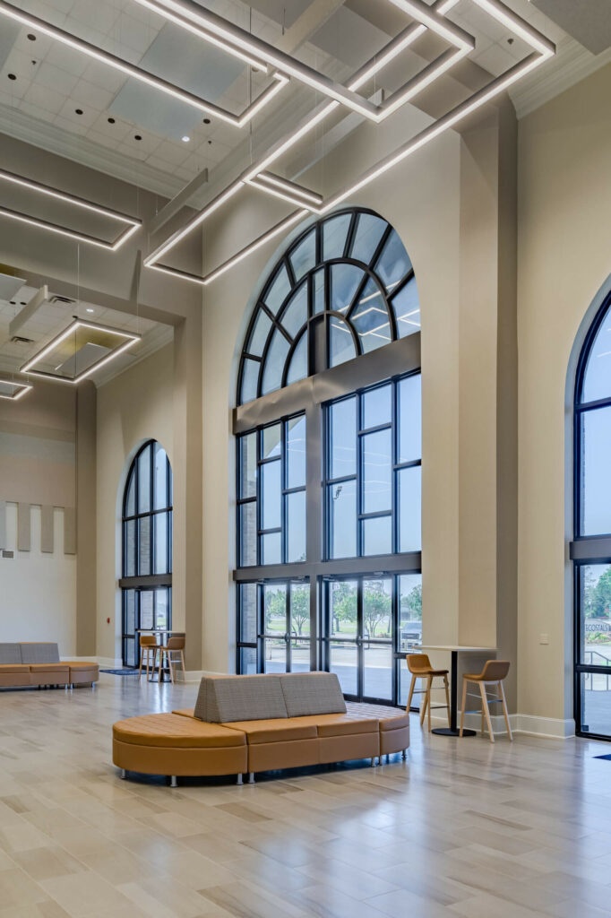 Glass church windows architecture design with furniture at Pentecostals of the Twin Cities designed by TBA Studio