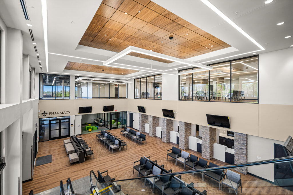 Double-height lobby at Winn Community Health Center with natural light and reception area
